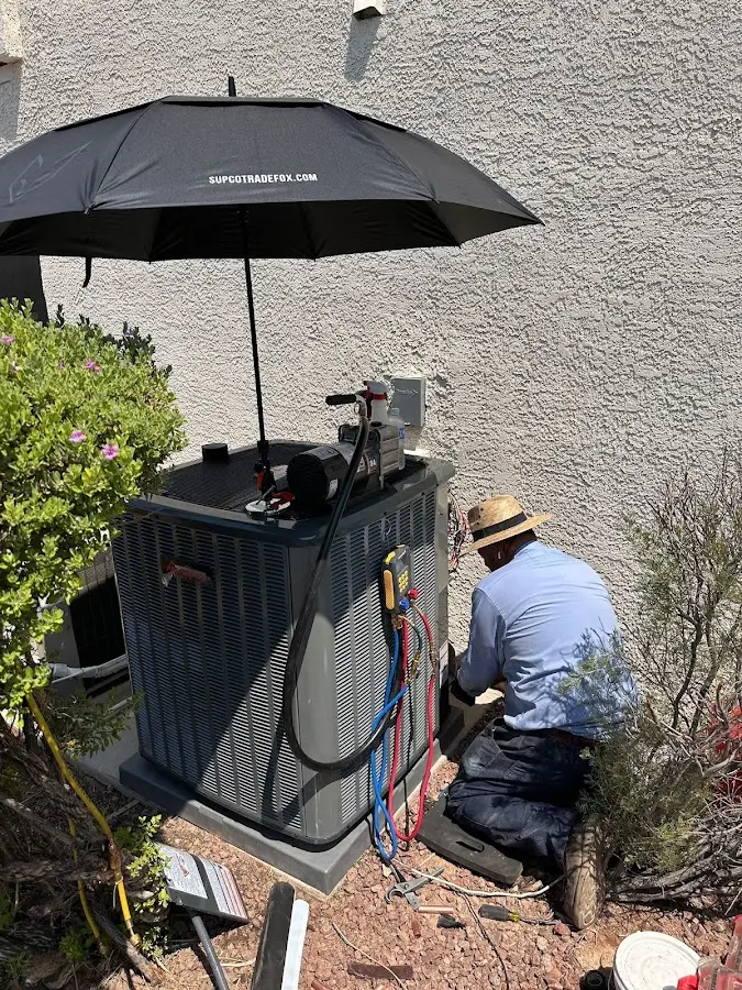 HVAC technician performing outdoor AC maintenance in Diamondhead